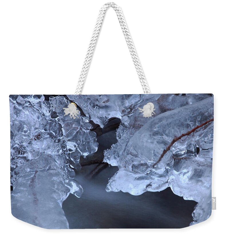 Blue Weekender Tote Bag featuring the photograph Growing ice formation over a river by Ulrich Kunst And Bettina Scheidulin