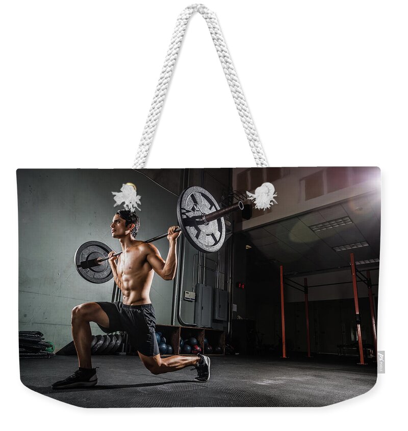 Hoisting Weekender Tote Bag featuring the photograph Gym Training With A Barbell by Michaelsvoboda