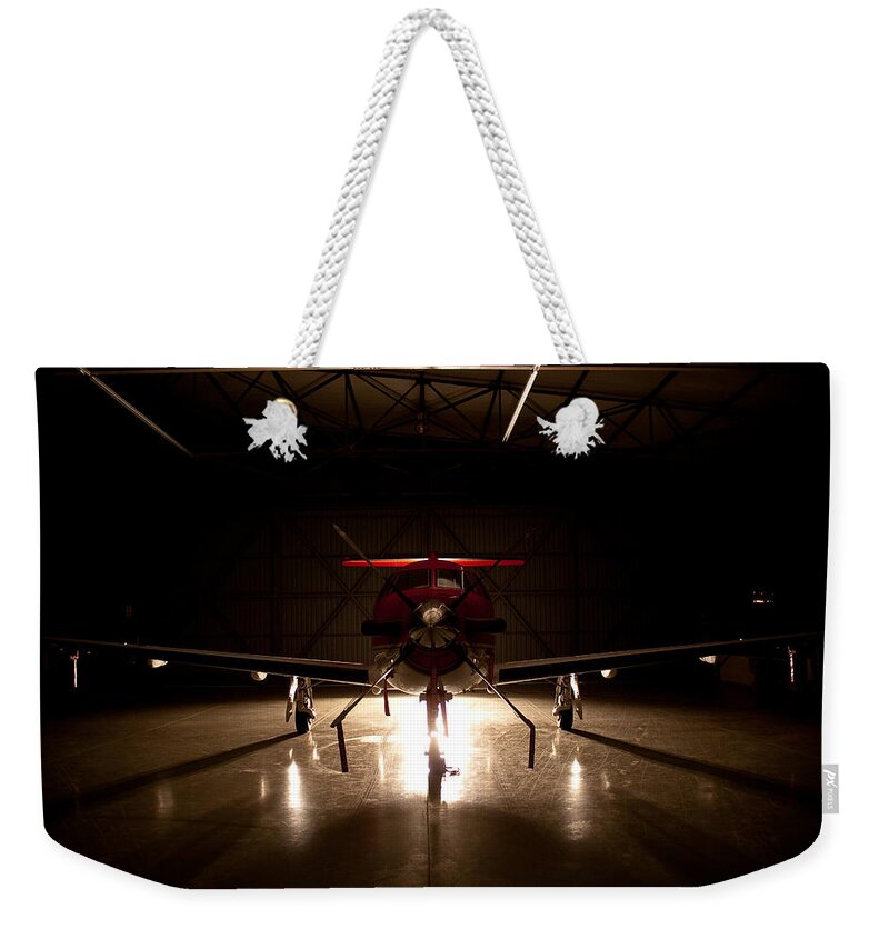 Pilatus Pc 12 Weekender Tote Bag featuring the photograph Hanger Light by Paul Job