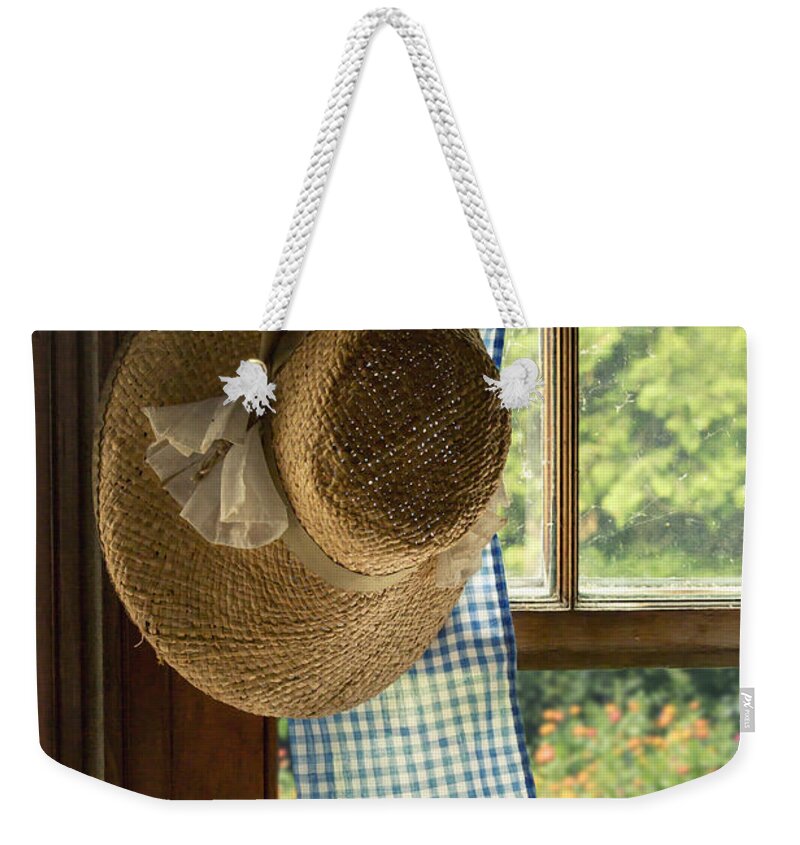 Straw; Hat; Flowers; Ribbon; Colorful; Brim; Waiting Weekender Tote Bag featuring the photograph Hanging by the Window by Margie Hurwich