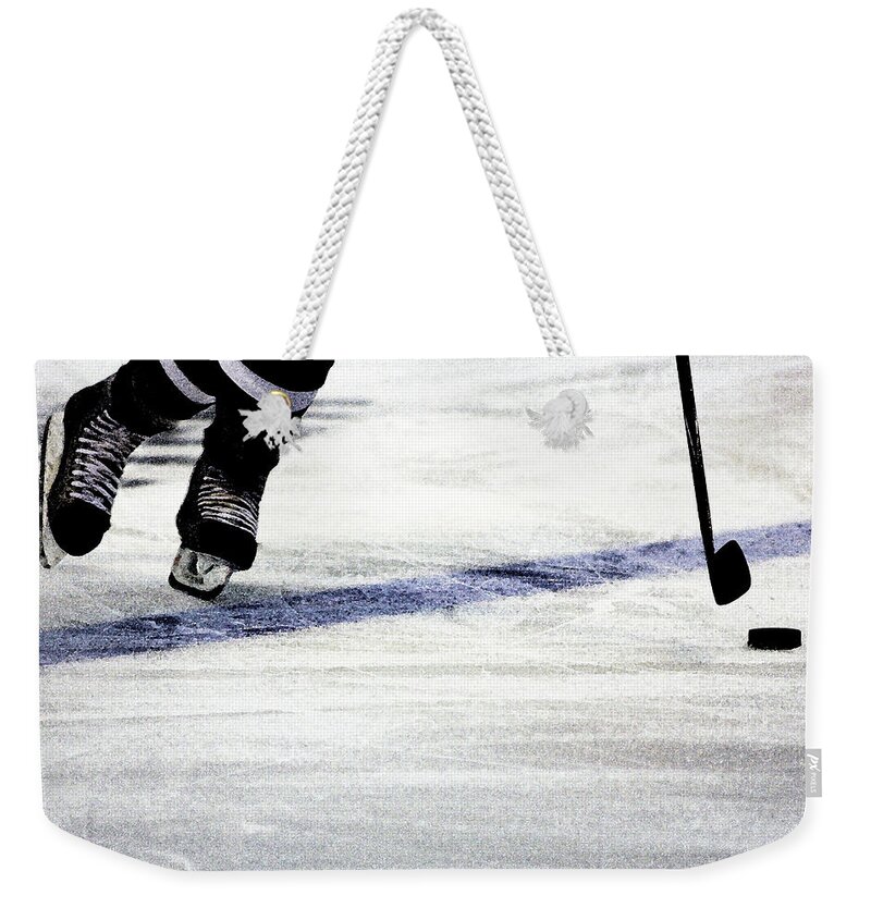 Hockey Weekender Tote Bag featuring the photograph He Skates by Karol Livote