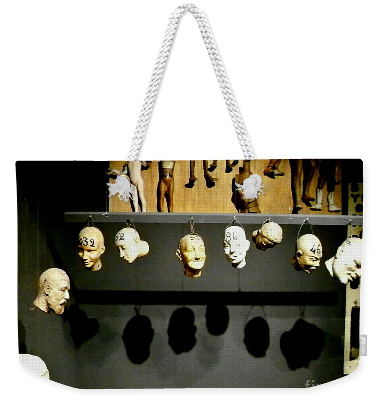 Newel Hunter Weekender Tote Bag featuring the photograph Heads will roll by Newel Hunter