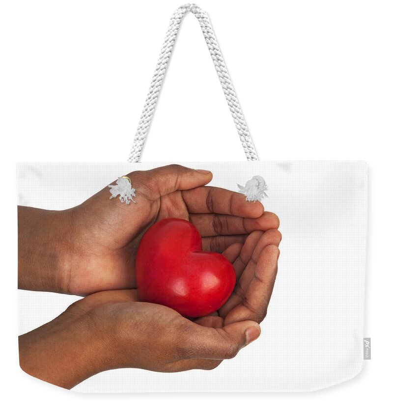 Heart Weekender Tote Bag featuring the photograph Heart in Hands by Chevy Fleet