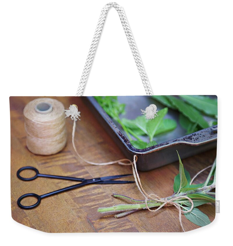 Wood Weekender Tote Bag featuring the photograph Herbs And String by Sharon Lapkin