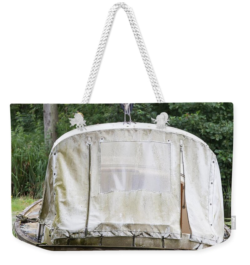 Heron Weekender Tote Bag featuring the photograph Heron perched on boat by Simon Bratt