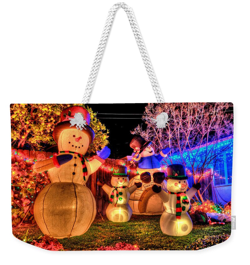 Christmas Decorations Weekender Tote Bag featuring the photograph Holiday Snowmen by Richard J Cassato