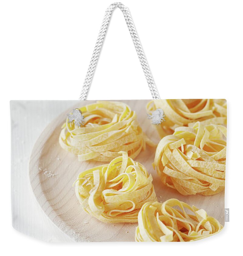 Italian Food Weekender Tote Bag featuring the photograph Homemade Italian Pasta by Oxana Denezhkina