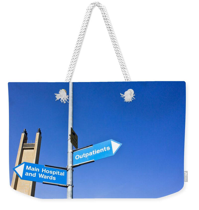 Accident Weekender Tote Bag featuring the photograph Hospital signs by Tom Gowanlock