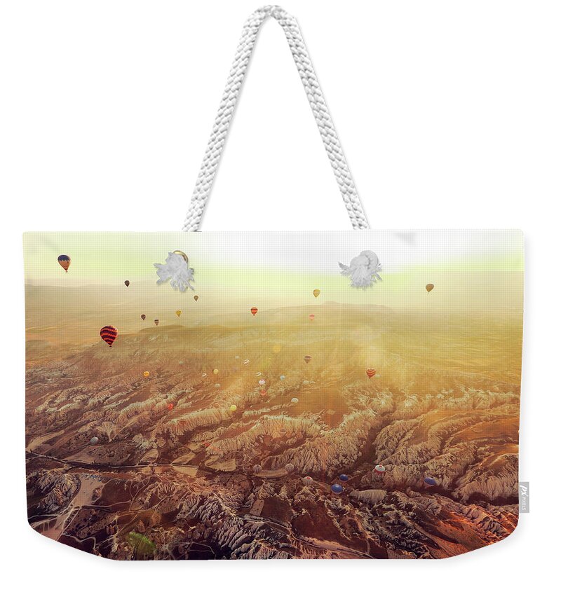 Scenics Weekender Tote Bag featuring the photograph Hot Air Balloons Flying Over by Unic