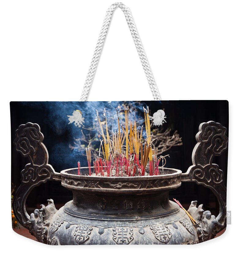 Aroma Weekender Tote Bag featuring the photograph Incense Sticks Burn In Large Ceremonial Temple Urn by Jo Ann Tomaselli