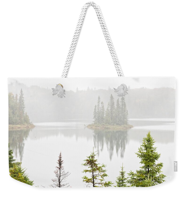 Island Weekender Tote Bag featuring the photograph Island in the fog by Les Palenik