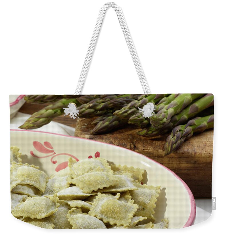 Italian Food Weekender Tote Bag featuring the photograph Italian Ravioli Pasta With Asparagus by Buena Vista Images