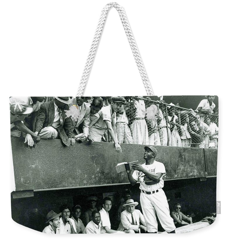 Jackie Robinson Weekender Tote Bag featuring the photograph Jackie Robinson signs autographs vintage baseball by Vintage Collectables