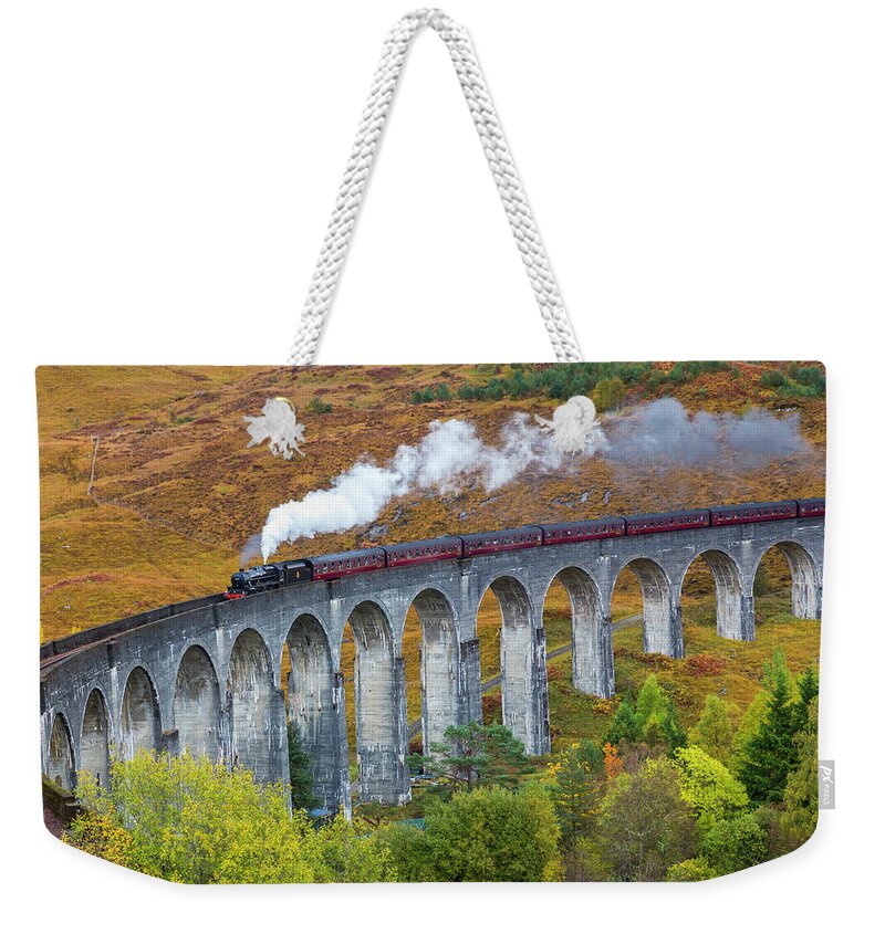 Arch Weekender Tote Bag featuring the photograph Jacobite Train On Glenfinnan Viaduct by Peter Adams