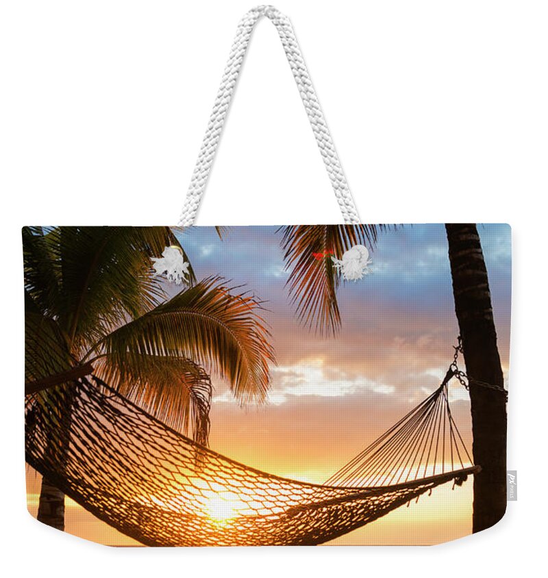 Hammock Weekender Tote Bag featuring the photograph Jamaica, Hammock On Beach At Sunset by Tetra Images