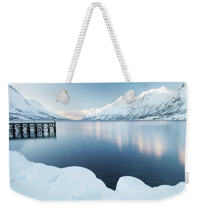 Scenics Weekender Tote Bag featuring the photograph Jetty At Ersfjordbotn In Norway by Getty Images