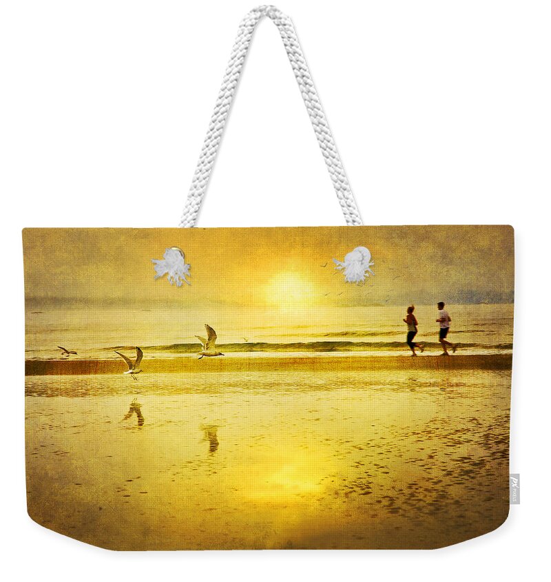 Beach Weekender Tote Bag featuring the photograph Jogging On Beach With Gulls by Theresa Tahara