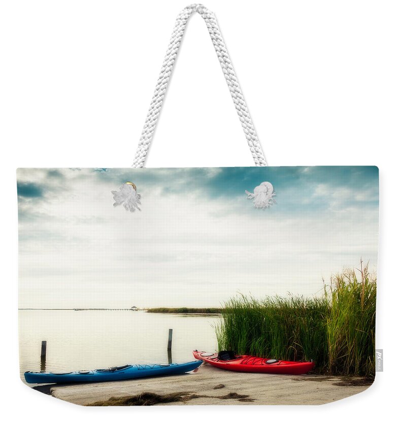 Water's Edge Weekender Tote Bag featuring the photograph Kayaks By Waters Edge by Catlane