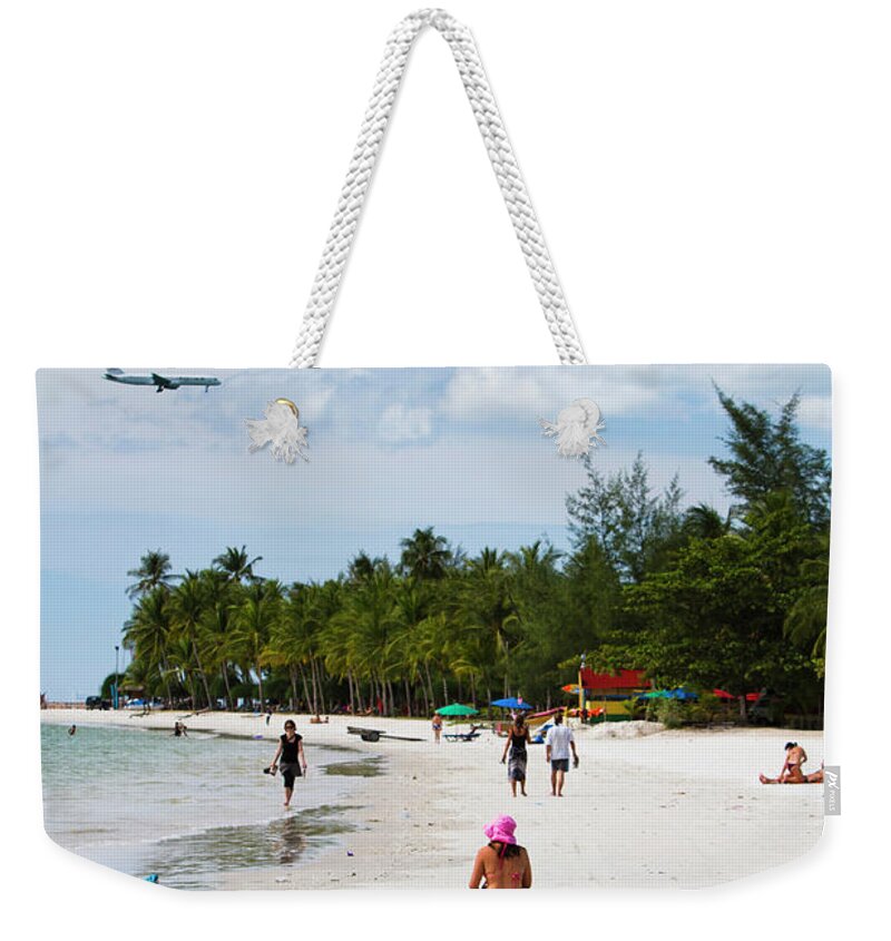 Southeast Asia Weekender Tote Bag featuring the photograph Lady Sunbathing At Cenang Beach by Matthew Micah Wright