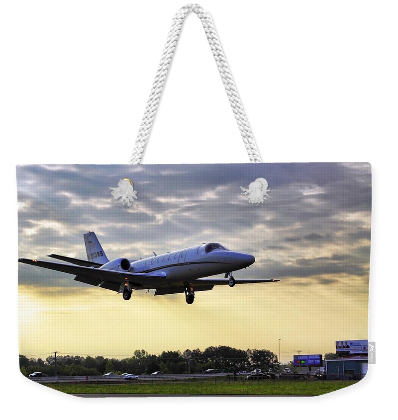 Airplane Weekender Tote Bag featuring the photograph Landing at Sunrise by Jason Politte