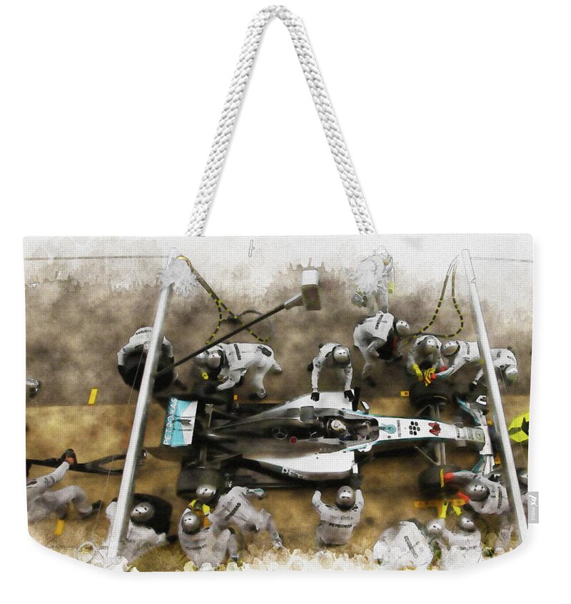Formula 1 World Championship Weekender Tote Bag featuring the digital art Lewis Hamilton of Britain service the car at pit stop by Don Kuing