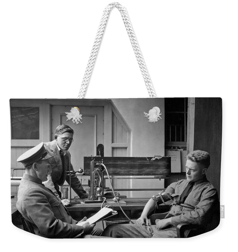 1924 Weekender Tote Bag featuring the photograph Lie Detector Test by Underwood Archives