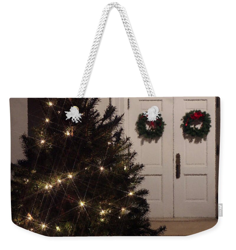 Christian Weekender Tote Bag featuring the photograph Lighted Christmas Tree with Church Doors at Night by Karen Lee Ensley