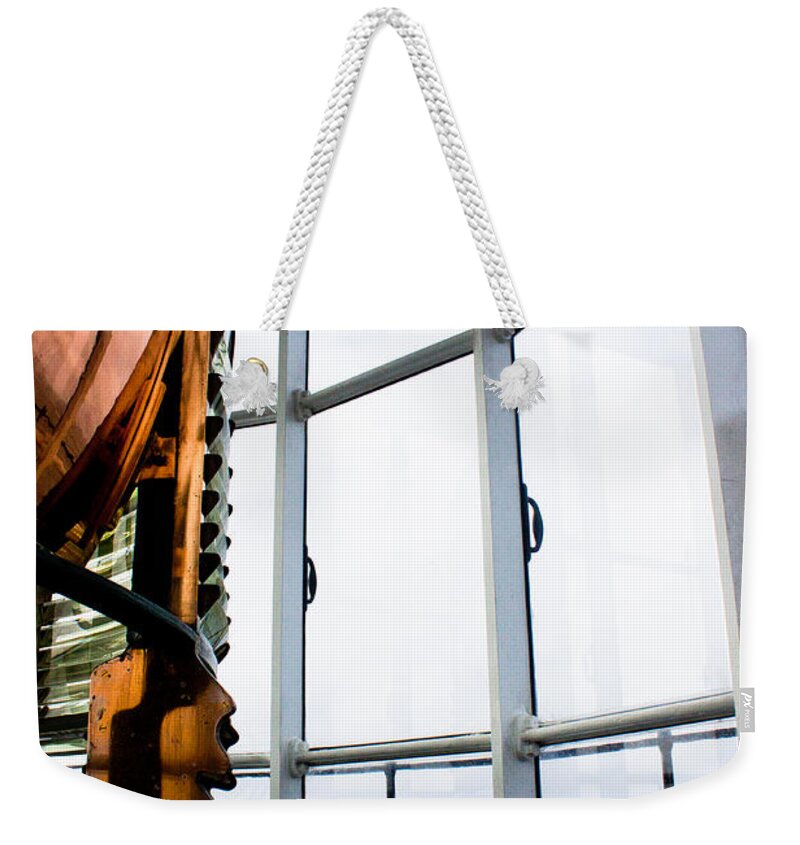 Lighthouse Weekender Tote Bag featuring the photograph Lighthouse Lens by John Daly