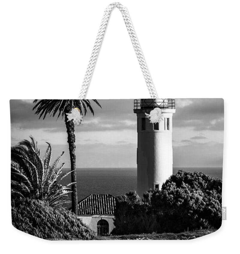 Black And White Photo Weekender Tote Bag featuring the photograph Lighthouse on the Bluff by Jerry Cowart