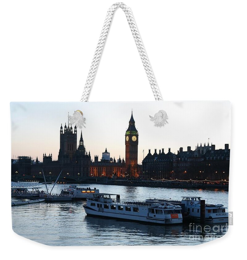 London Weekender Tote Bag featuring the photograph Lighting Up Time on the Thames by Jeremy Hayden