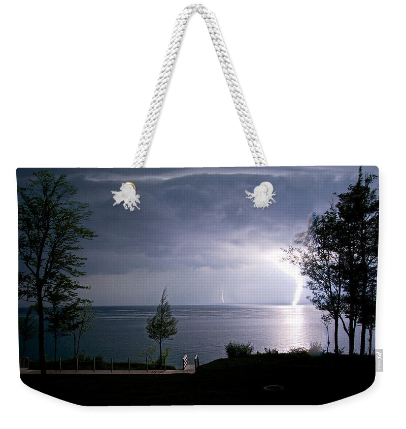 Landscapes Weekender Tote Bag featuring the photograph Lightning on Lake Michigan at Night by Mary Lee Dereske