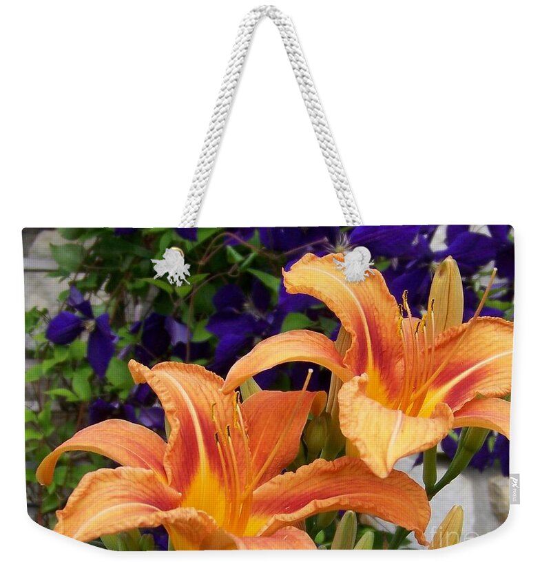 Lilies Weekender Tote Bag featuring the photograph Lilies and Clematis by Jackie Mueller-Jones