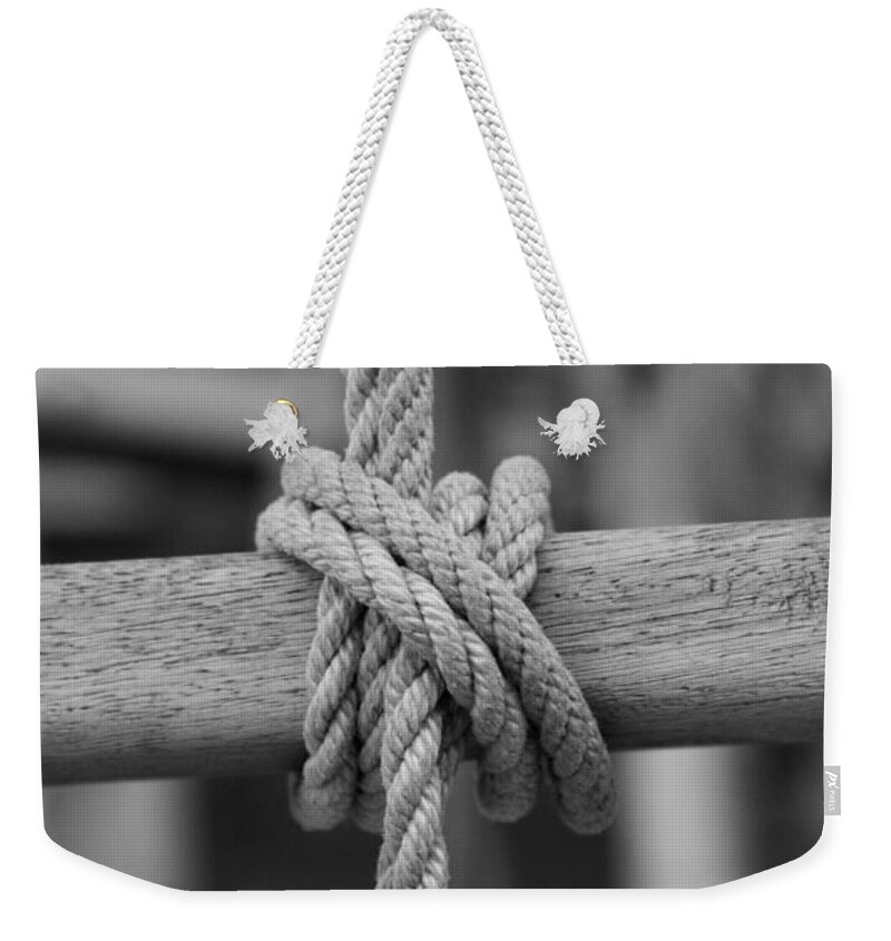 Black And White Weekender Tote Bag featuring the photograph Line secured to a wooden bar by Ulrich Kunst And Bettina Scheidulin