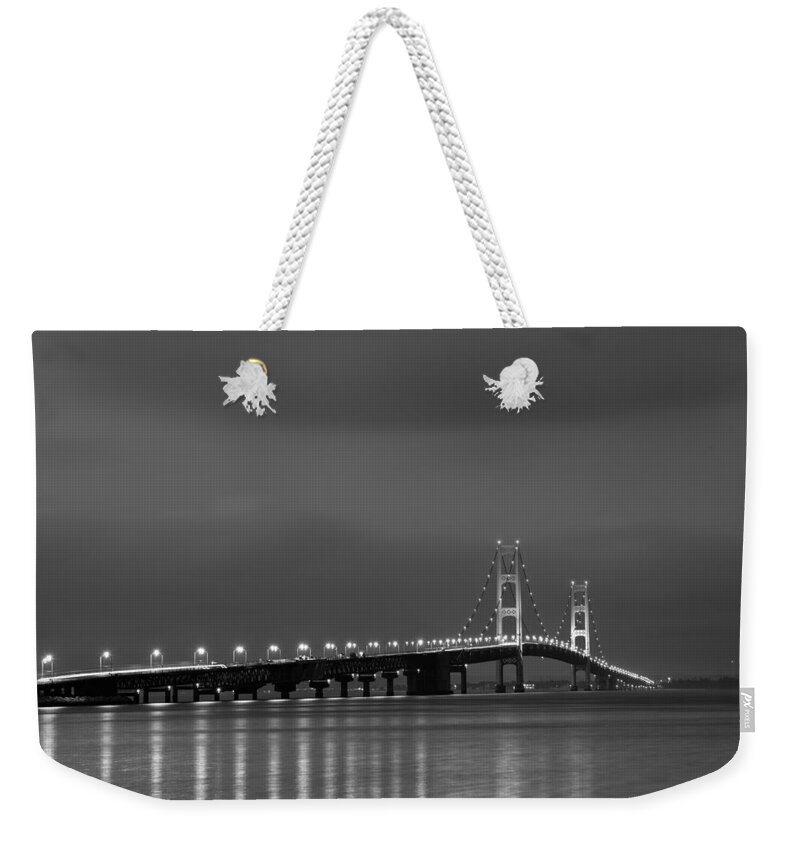 Dusk Weekender Tote Bag featuring the photograph Mackinac Bridge Black and White by Sebastian Musial