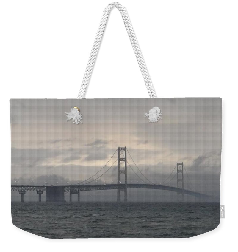 Michigan Weekender Tote Bag featuring the photograph Mackinac Bridge in the Rain by Keith Stokes
