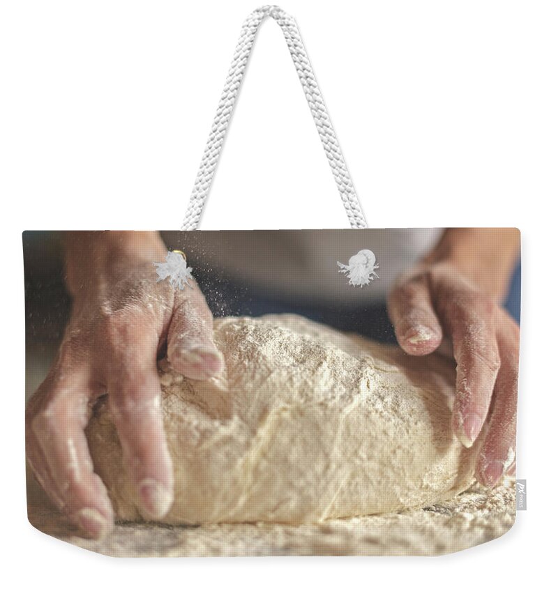 Kneading Weekender Tote Bag featuring the photograph Making Yeast Dough by Nimis69