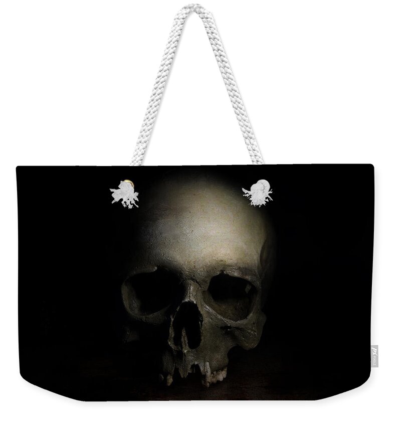 Human Weekender Tote Bag featuring the photograph Male skull by Jaroslaw Blaminsky