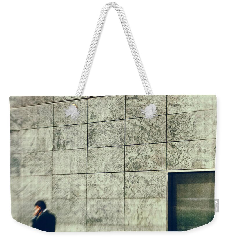 Architecture Weekender Tote Bag featuring the photograph Man with cell phone by Silvia Ganora