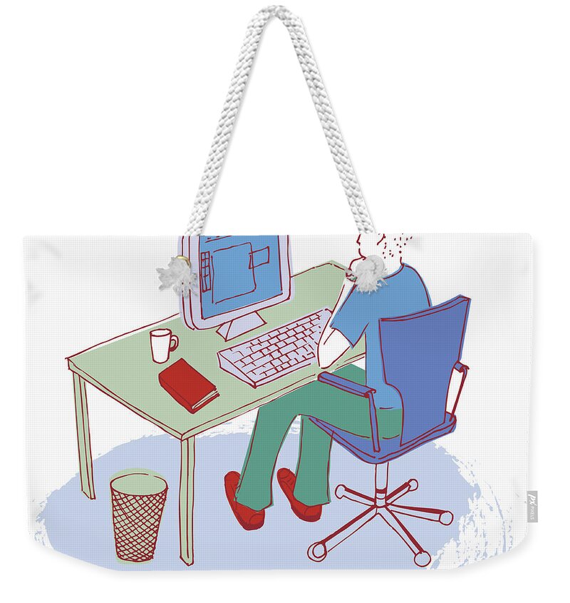 20-25 Weekender Tote Bag featuring the photograph Man Working At Desk Using Computer by Ikon Ikon Images