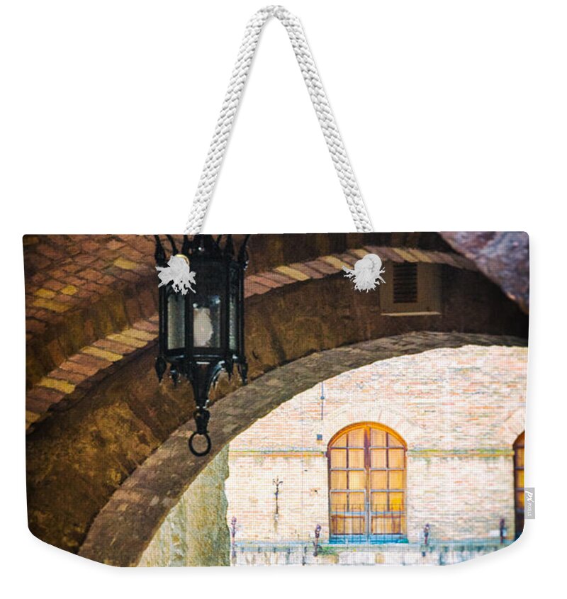 Ancient Weekender Tote Bag featuring the photograph Medieval arches with lamp by Silvia Ganora
