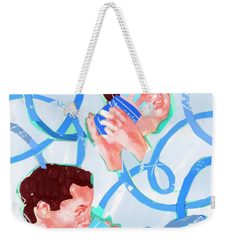 Acknowledging Weekender Tote Bag featuring the photograph Men Talking Into Tin Can Telephone by Ikon Ikon Images