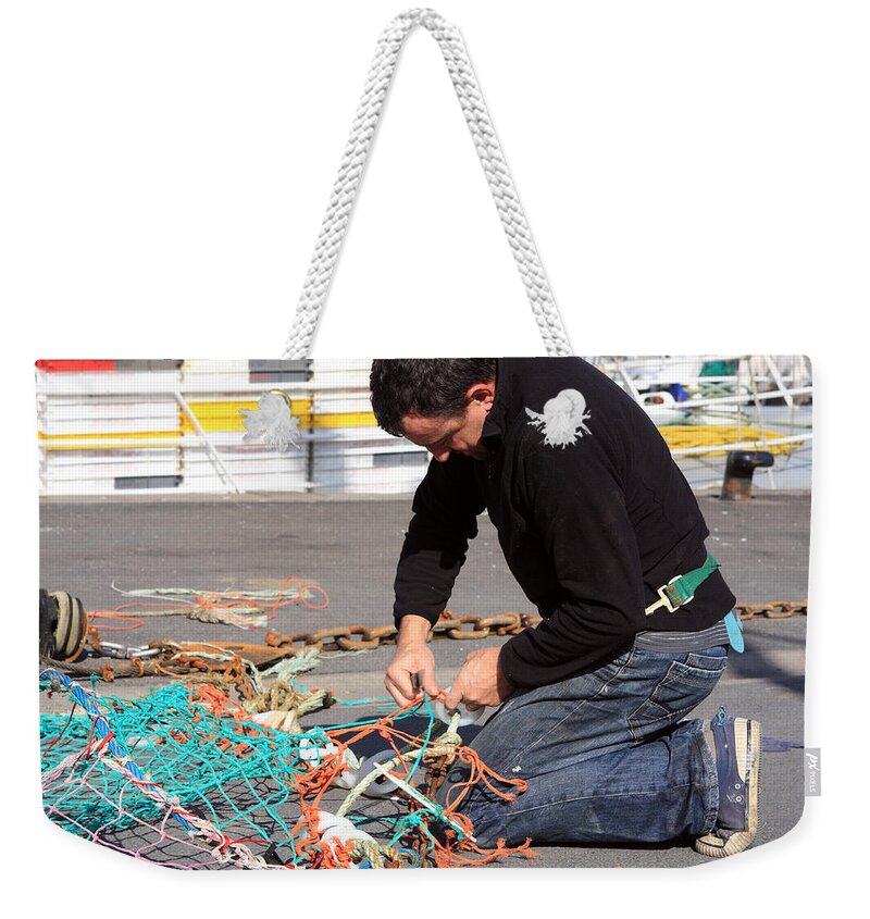 Fishing Weekender Tote Bag featuring the photograph Mending The Nets by Aidan Moran