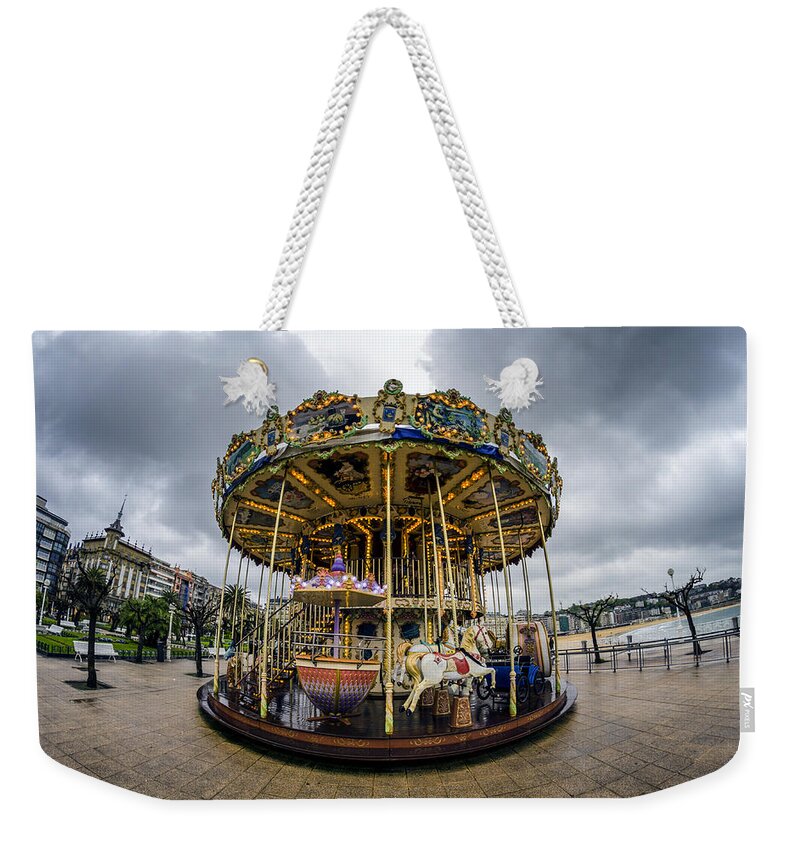 Merry Weekender Tote Bag featuring the photograph Merry-go-Round by Pablo Lopez