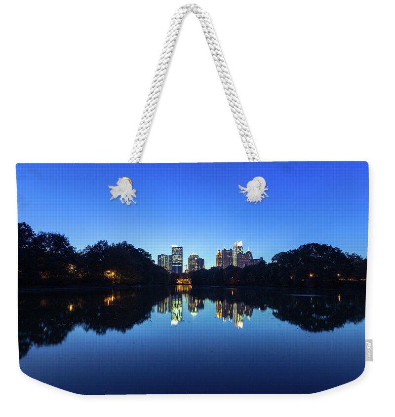 Atlanta Weekender Tote Bag featuring the photograph Midtown Atlanta Reflected In The Lake by Moreiso