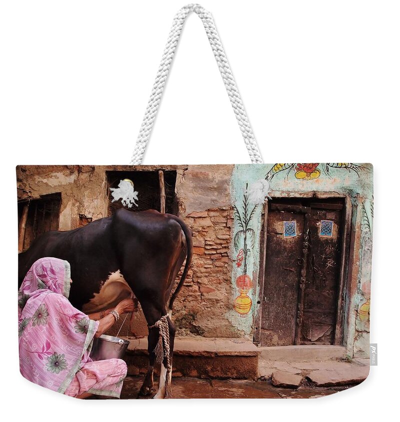 Headwear Weekender Tote Bag featuring the photograph Milking Time by Roselyne Calle Mirio
