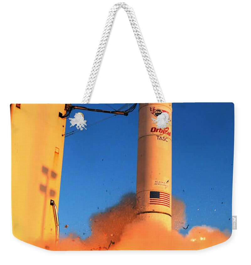 Astronomy Weekender Tote Bag featuring the photograph Minotaur Iv Rocket Launches Falconsat-5 by Science Source
