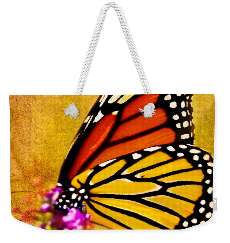 Monarch Weekender Tote Bag featuring the photograph Monarch Butterfly Color Splash Sunset by Carol F Austin