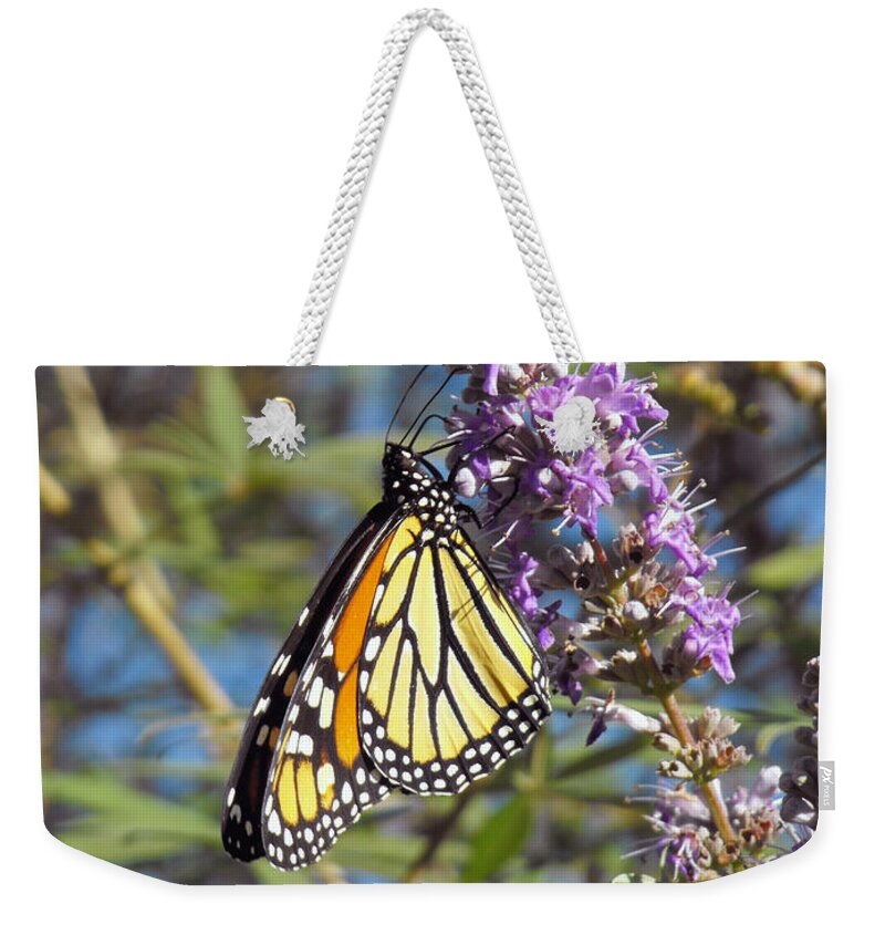 Butterfly Weekender Tote Bag featuring the photograph Monarch on Vitex by Jayne Wilson