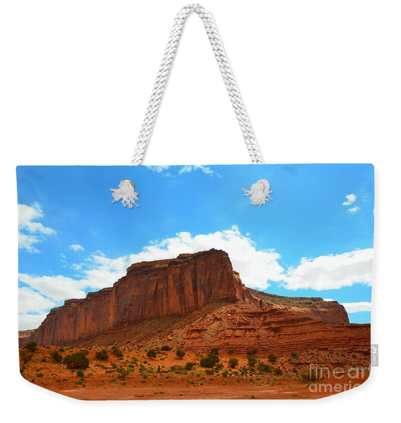 Monument Valley Weekender Tote Bag featuring the photograph Monument Valley Rock Formation and Clouds by Debra Thompson