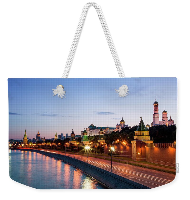 Tranquility Weekender Tote Bag featuring the photograph Moskva River And Kremlin Buildings At by Holger Leue